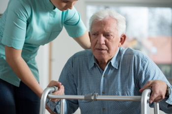 Home health nurse with elderly man.