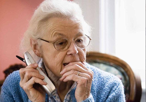 Elderly woman being scammed.